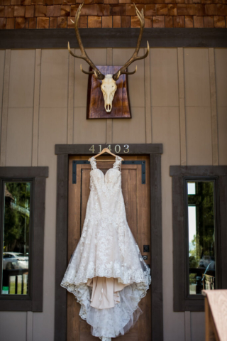Close Up of Dress Hanging from Lodge Front Entrance