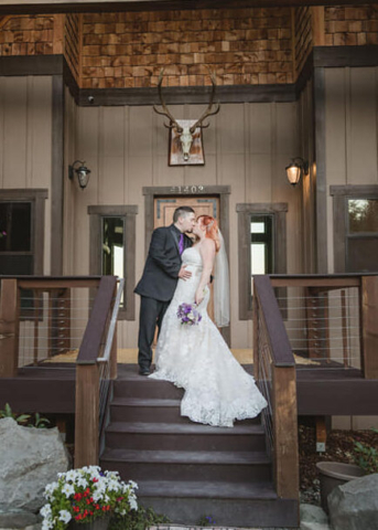 Bride and Groom Kiss on Steps