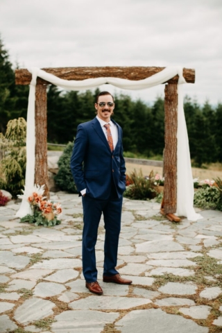 Groom in Front of Arbor